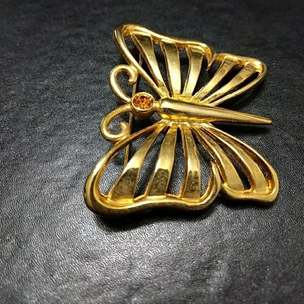 Vintage gold tone butterfly with rhinestone pin brooch